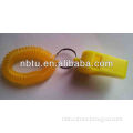 Plastic whistle with coil bracelets